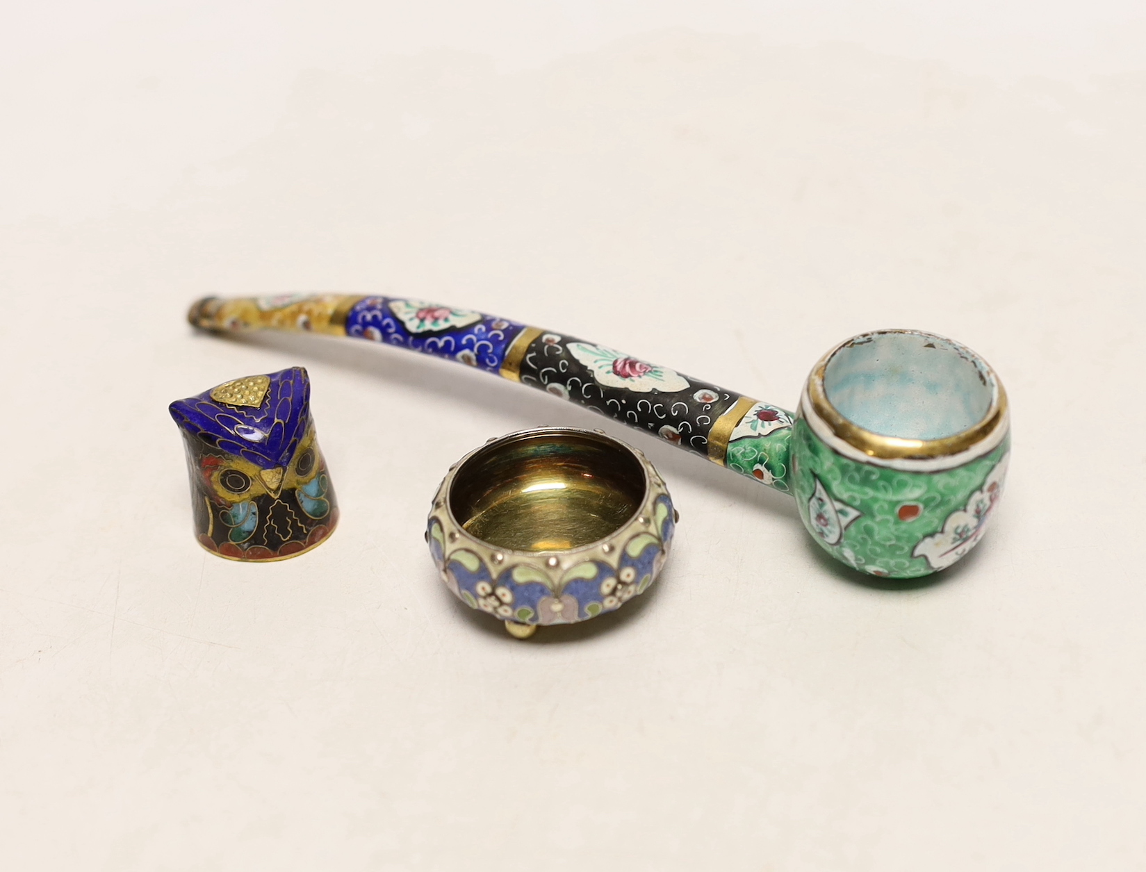 A late 19th/early 20th century Russian 84 zolotnik and cloisonné enamel small salt by Pavel Ovchinnikov, 34mm, together with an enamelled pipe and 'owl' thimble holder.